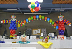 balloon arch table backdrop with balloon sculptures