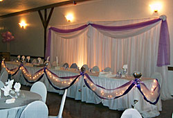 Head table with Lights and Ribbon Draping
