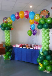 Balloon arch over child's birthday table