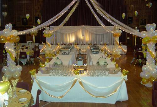 Balloon columns and canopy over buffet tables