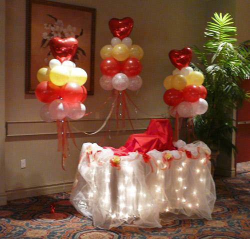 cake table with balloon clouds