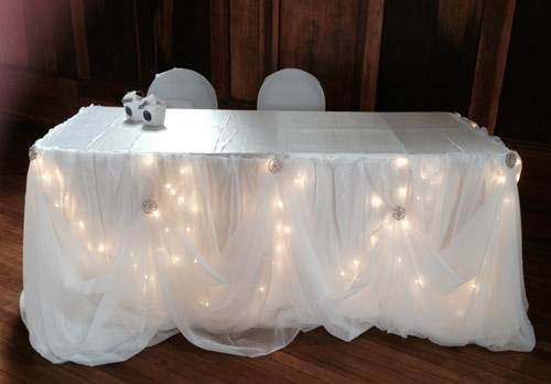 Focal table with ribbon draping