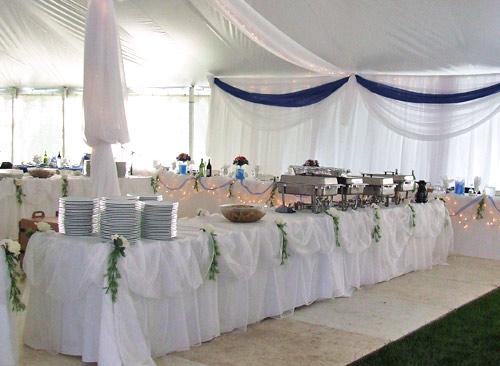 decorated buffet tables in tent