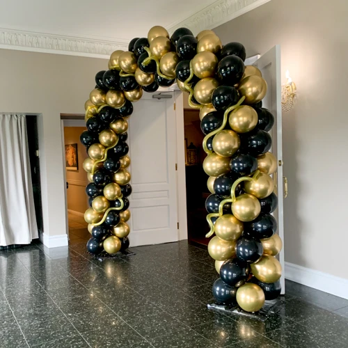 gold and black balloon doorway arch
