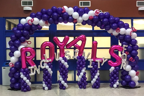 purple and white arch for school event