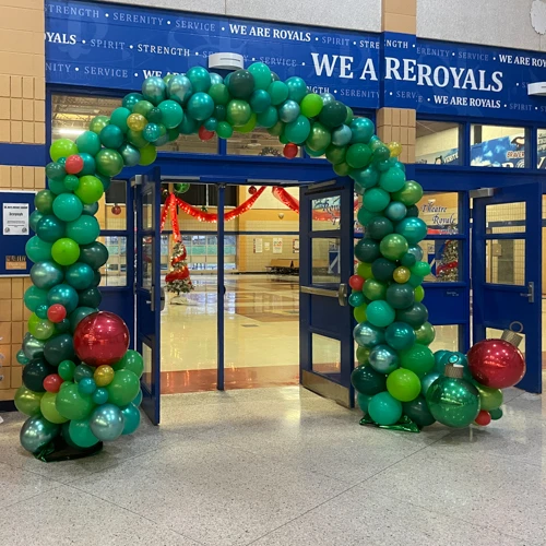 green balloon arch for Christmas dance