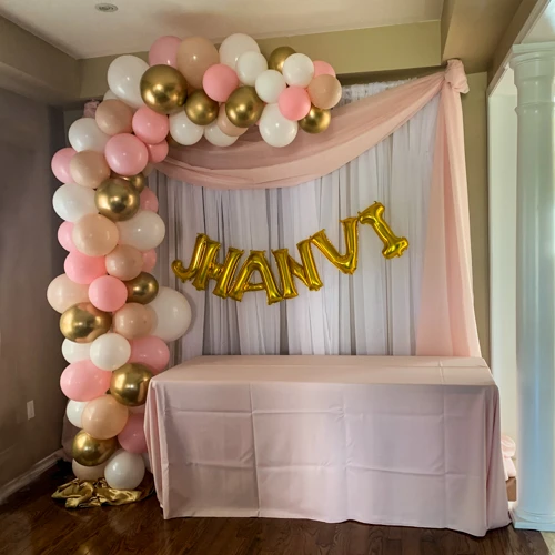 pink, white, and gold organic balloon arch