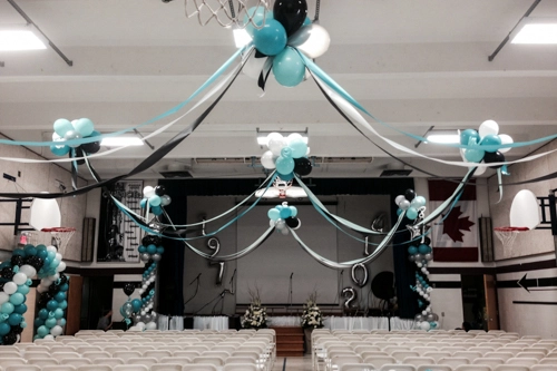 turquoise, black and white balloons and streamers ceiling treatment