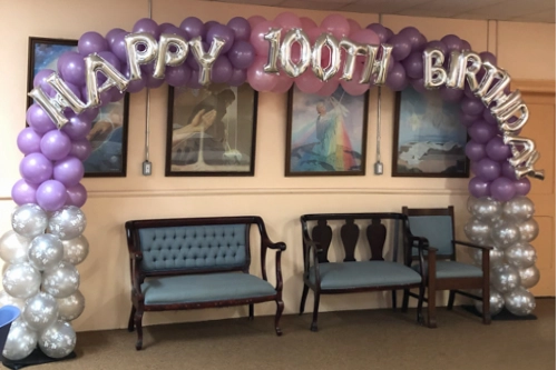 100th birthday arch in silver, mauve and pink