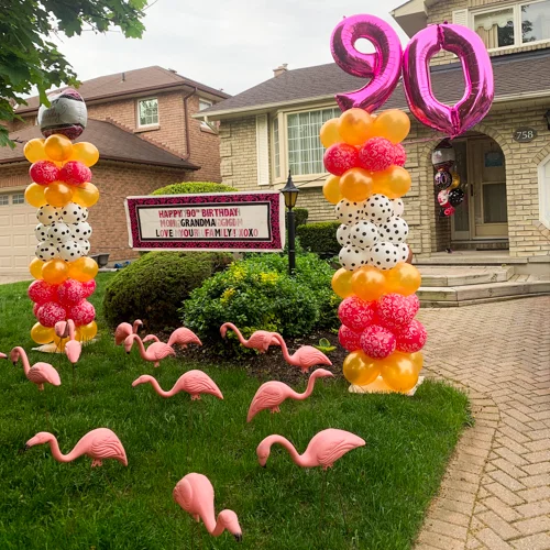 birthday columns and pink flamingoes