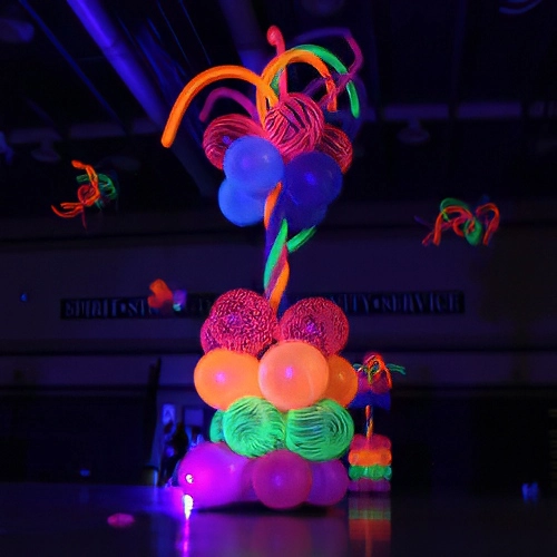 high school dance with glow-in-the-dark balloon columns