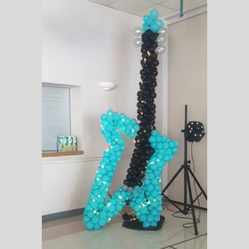 turquoise and black balloon guitar