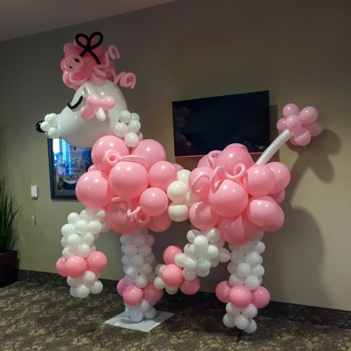 pink and white balloon poodle sculpture