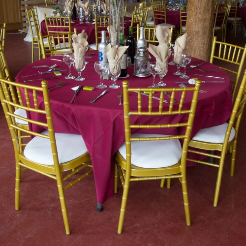 chiavari chairs and burgundy tablecloth