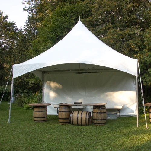 small tent with barrel tables