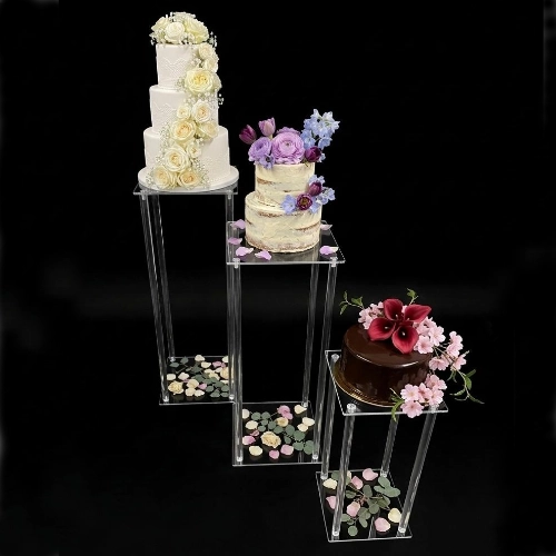 clear acrylic plinths can be used to display wedding cakes, floral arrangements, and signage