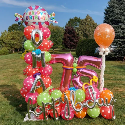 balloon sculpture for 75th birthday with polka dot latex balloons and foil balloon letters