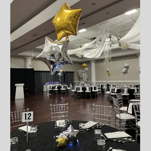 High school prom decor for Starry Nights theme--black, silver, and gold