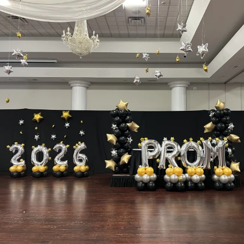 High school prom decor for Starry Nights theme--black, silver, and gold