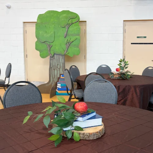 centrepieces for Education Gala with apple, books, wooden base