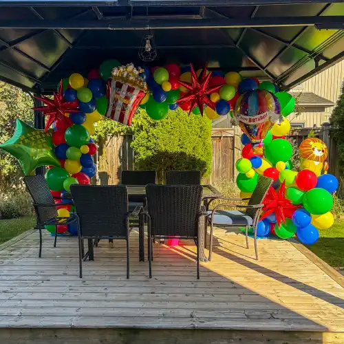 colourful balloon arch for child's birthday with carnival theme